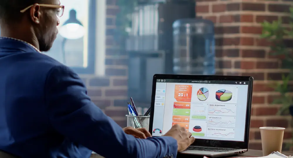 Course thumbnail: a man sitting at a desk using a laptop