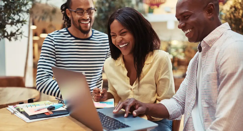 Course thumbnail: a group of people looking at a laptop